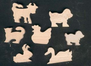 Zakje met 7 houten figuurtjes met boerderijthema